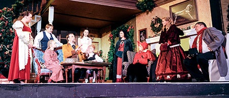 Randy Forster playing Clement, tells the story of the sugarplum fairies during a dress rehearsal for “’Twas the Night Before Christmas,” Wednesday night at the Paramount Theatre.