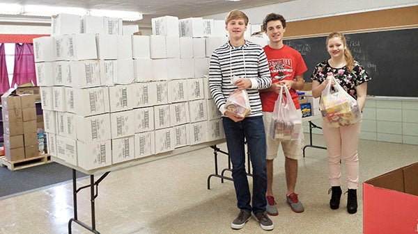 Members of the Women’s Leadership Initiative and Austin High School Student Council teamed up to collect food and cash donations to benefit the WLI Weekend Food Backpack program. The program collected over 12,000 food items. 