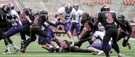 Grand Meadow's Landon Jacobson vaults across the line on a run in the first quarter against Edgerton-Ellsworth in the Minnesota State Prep Bowl Nine Man championship Friday at TCF Bank Stadium in Minneapolis. Eric Johnson/photodesk@austindailyherald.com