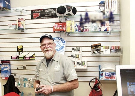 Everything Hobby owner Kevin Guy flies a remote-controlled quadcopter in his Austin store Monday afternoon.  Photos by Jason Schoonover/jason.schoonover@austindailyherald.com