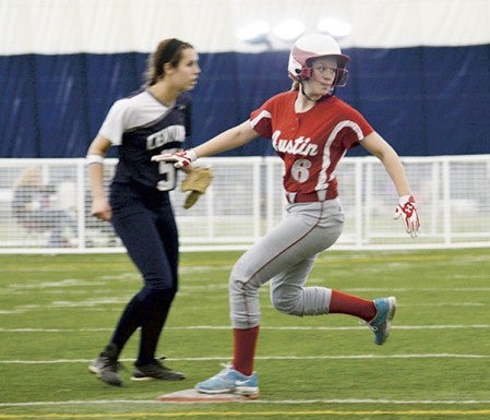 Austin’s Erin Dankert holds up at second base in the first game of a doubleheader in the RCTC Dome last April.  Herald File Photo