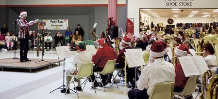 The annual TubaChristmas concert took place at the Oak Park Mall Saturday. The group of 48 players performed about 12 different Christmas carols, directed by Brad Mariska and Dennis Conroy, in front of an audience that filled the mall’s hallway. Photos by Jenae Hackensmith/jenae.hackensmith@austindailyherald.com