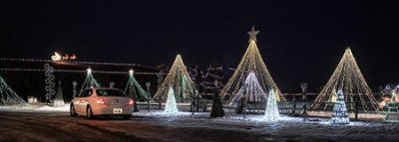 A car stops to watch the musically-synced Christmas light show at the Severson farm south of Hayfield Thursday night. 