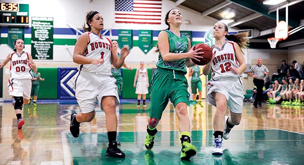 Lyle-Pacelli's Brooke Walter heads in for two off a breakaway in the first half against Houston Tuesday night in Pacelli. Eric Johnson/photodesk@austindailyherald.com