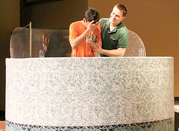 Pastor Corey Goetz baptized Johnson at Cornerstone Church on April 27, 2014. He accepted God into his heart when he came to Austin to study as a foreign exchange student from China. -- Photo provided