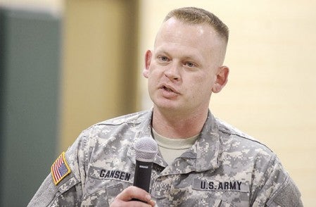 Sgt. 1st Class David Gansen brings guests up to speed on some of the changes and upgrades to the National Guard Armory Tuesday afternoon. Eric Johnson/photodesk@austindailyherald.com