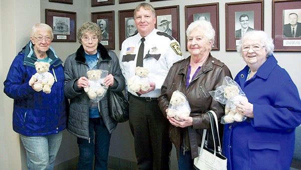 From left, Deloris Schewe, Janet Marsden, Mower County Chief Deputy Mark May, Eunice Benson and Doris Draayer pose with a collection of stuffed bears recently donated from the Royal Neighbors of America, Chapter 1329, out of Oakland. -- Photo Provided