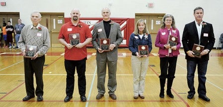 Six former athletes were inducted into the Austin Hall of Fame at halftime of Friday night’s Austin Packers boys basketball game against Faribault. Those honored were Col. John R. Lund, Jason Smith, Wesley Hompe, Robert Anhorn (accepted by daughter Nancy Zahn), Gerald Hoilien (accepted by daughter Kate Hoilien) and John Higgins. Eric Johnson/photodesk@austindailyherald.com