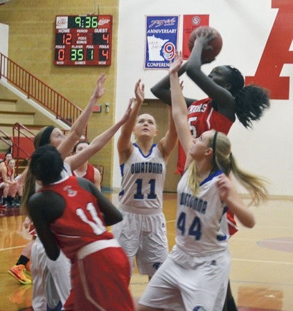 Austin's Ruth Koang goes up for a shot against Owatonna in Packer Gym Monday. -- Rocky Hulne/sports@austindailyherald.com
