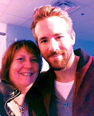 Four Daughters Vineyard and Winery co-owner Vicky Vogt poses with actor Ryan Reynolds at the Sundance Film Festival in Utah. 