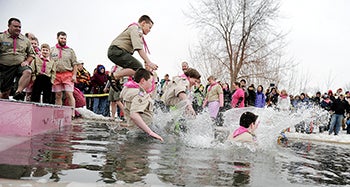 Members of Boy Scout Troop 113 hit the water during the Polar Plunge.