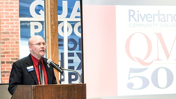 Director of Instructional Technology and Intellectual Property J.C. Turner speaks during the program recognizing Riverland Community College for reaching 50 online courses that are Quality Matters certified. Jenae Hackensmith/jenae.hackensmith@austindailyherald.com