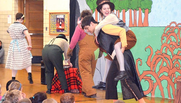 Brer Rabbit (Cassidy McCartan) sits on Brer Fox’s back (Sal Frattallone) as the characters in “Rabbit Tales” starts on a three-day journey to a cave during the 45-minute play on Tuesday afternoon at Neveln Elementary School. The entire school came to watch the performance, which showcased Brer Rabbit finding out how to respect his friends. Photos by Jenae Hackensmith/jenae.hackensmith@austindailyherald.com