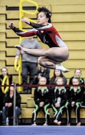 Austin's Jennifer Boyle performs during the floor at the Section 1A meet in Packer Gym Saturday. Eric Johnson/photodesk@austindailyherald.com