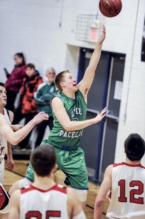 Lyle-Pacelli's Braden Kocer gets the finger-roll in the second half against Bethlehem Academy in the Section 1A West Playoffs Thursday night in Lyle. Eric Johnson/photodesk@austindailyherald.com