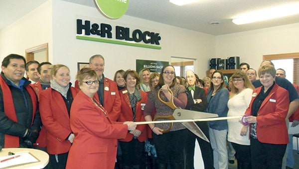 Austin Area Chamber of Commerce Ambassadors held a ribbon cutting for H&R Block, now owned by Jason Barnes. The Austin office, located at 701 W. Oakland Ave., is managed by Licensed Tax Advisor Elizabeth Schmitz, who is pictured center. Photos provided