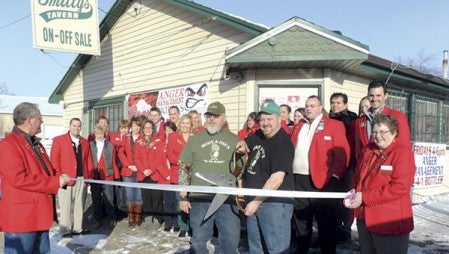 Chamber ambassadors held a ribbon cutting ceremony for the new members and owners of Smitty’s Tavern on Jan. 9. Wayne “Hoot” Enright and his wife, Judy, purchased the business last fall along with Jeremy “Ole” Olson, who is pictured in the center. 