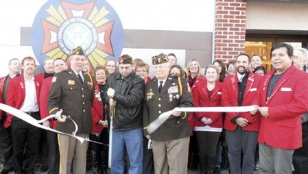 Chamber ambassadors welcomed the Austin VFW Post 1216 to the Chamber with a ribbon cutting in front of the recently renovated club at 300 Fourth Ave. NE. Cutting the ribbon, center of photo, were VFW Commander Scott Wiechmann, Drew Wendorf and Norm Hecimovich. 