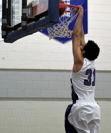 Riverland's Devonte Miller goes up for a dunk in Riverland Gym Wednesday. Rocky Hulne/sports@austindailyherald.com
