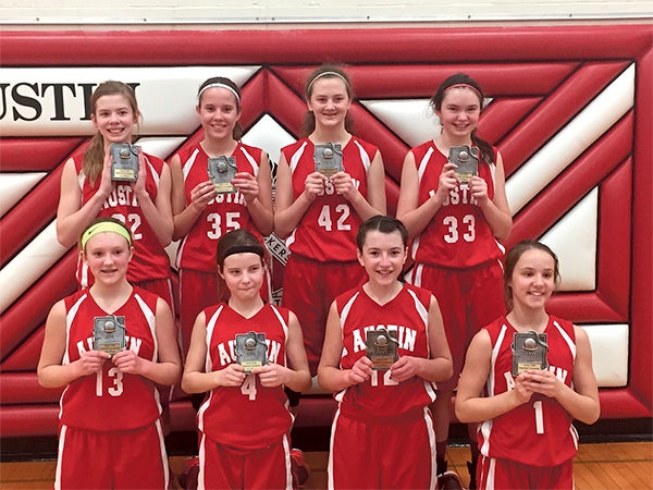The 7th grade Austin girls basketball team took first place in their tournament in Austin on Jan. 25. Back row (left to right): Erica Lundberg, Brittany Wolter, Emily Bollum and Carly Snee; front row: Destiny Gray, Grace Mayer, Ellie Tupy and Elyse Hebrink -- Photo Provided