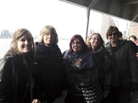 Alisha Grobner (left), Terri Rauenhorst, Anita Stephens, Kimberly Schiltz and Charlotte Elvebak stand near the water in New York City. This is part of a larger group of 20 students and community members who went to New York City through a trip organized by Riverland Community College to help the travelers see new culture and have new experiences. Photo provided.