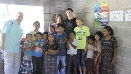 The Schwab family on their trip to Guatemala in 2013 as part of Project Spammy. The trip was therapuetic for the family as Pat and Beth lost their daughter Lauren that April. Photo provided