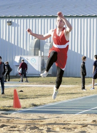 Austin's Adam Bergstrom jumps for the Packers at the Faribault Invite Tuesday. Adam Holt/Faribault Daily News