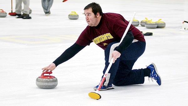 Kurtis Retterath competes in the curling league in Riverside Arena Monday. Rocky Hulne/sports@austindailyherald.com
