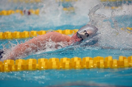 Austin's Ben Walker swims in the 400-yard freestyle relay in the Class A state swimming and diving meet in the University of Minnesota Aquatic Center last Winter. Herald File Photo