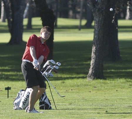Austin's Ethan Morey chips a shot at Austin Country Club Monday. Rocky Hulne/sports@austindailyherald.com