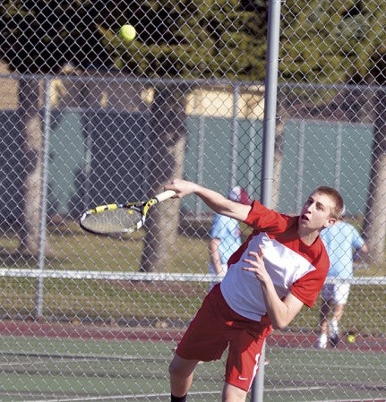 Austin's Jens Ourada plays in the No. 1 doubles match against Albert Lea Monday. Rocky Hulne/sports@austindailyherald.com