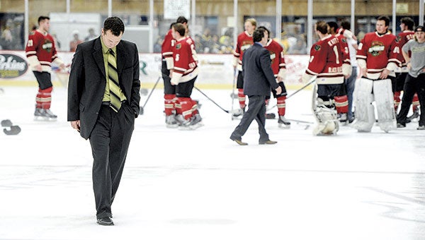 Austin Bruins head coach Chris Tok walks off the ice as the Minnesota Wilderness celebrate winning the Robertson Cup Saturday night at Riverside Arena. 