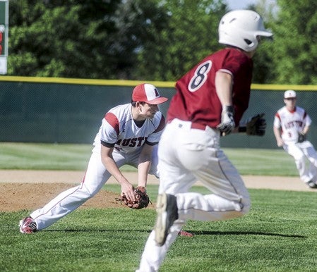 Austin pitcher Nik Gasner fields a grounder to get the put-out on Lakeville South's Casey Carlson during the first inning in their first round playoff game in the Section 1AAA Tournament Thursday at Dick Seltz Field. Eric Johnson/photodesk@austindailyherald.com