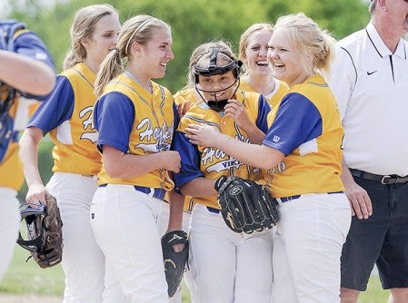 Teammates surround Hayfield pitcher Jackie Sanvick after the Vikings claimed the Section 1A West Division championship Friday afternoon over Blooming Prairie at Todd Park. Eric Johnson/photodesk@austindailyherald.com