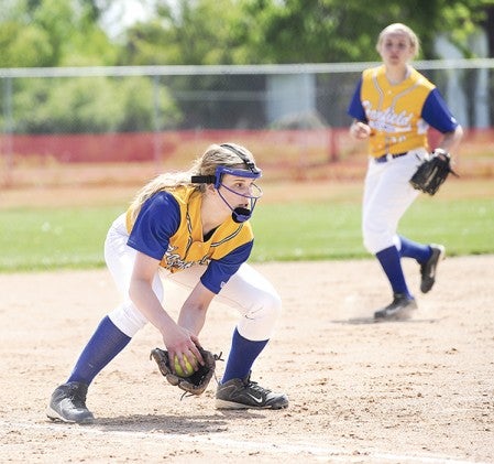 Hayfield third baseman Olivia Matti fields a grounder and looks to throw in the Section 1A West Division championship against Blooming Prairie Friday afternoon at Todd Park. Eric Johnson/photodesk@austindailyherald.com