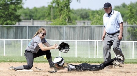 Blooming Prairie's Tessa Ivers slides into second on a stolen base attempt as the ball skips past Fillmore Central's  Megan Hendrickson in the Section 1A playoffs Wednesday at Todd Park. Eric Johnson/photodesk@austindailyherald.com