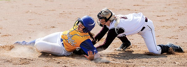 Hayfield's Brooke Zahnle just makes it back ahead of the tag of Chatfield's Megan LaPlante during a pick-off attempt from home in the Section 1A playoffs Wednesday at Todd Park.  Herald File Photo