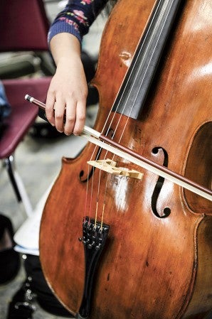 Austin High School junior Abby Sencio plays the Miller cello, a cello that has been appraised at $38,000.