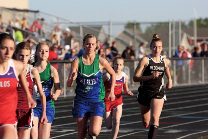 From left: Lyle-Pacelli's Hannah Nelson, Madison Truckenmiller and Blooming Prairie's Alana Grant run in the 800-meter run in the Section 1A-Subsection 2 track and field meet in Grand Meadow Thursday. -- Photo Provided by Colleen Nelson