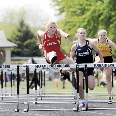 Austin's Rachel Quandt runs in the 100-meter hurdles at the Big Nine track and field meet in Mankato East Saturday. Adam Holt/Faribault Daily News
