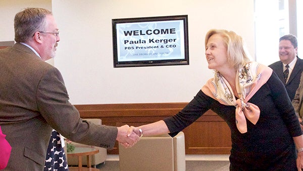 Public Broadcasting Service CEO and President Paula Kerger shakes hands Monday with Dr. Ted Hinchcliffe.  - Photo provided