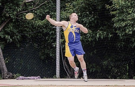 Hayfield's Cody Carpentier makes his second throw in the discus during the Minnesota Class State Track and Field Meet Saturday at Hamline University. Eric Johnson/photodesk@austindailyherald.com
