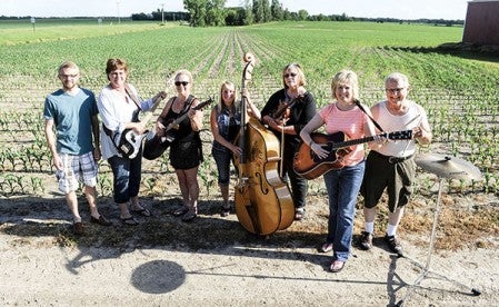 The local group of Who Let the Momma’s Out consists of Kalle Akkerman, from left, Theresa Tucker, Dee Randall, Sherry Berndt, Wendy Larson, Rhonda Akkerman and Jack Mathison. Eric Johnson/photodesk@austindailyherald.com