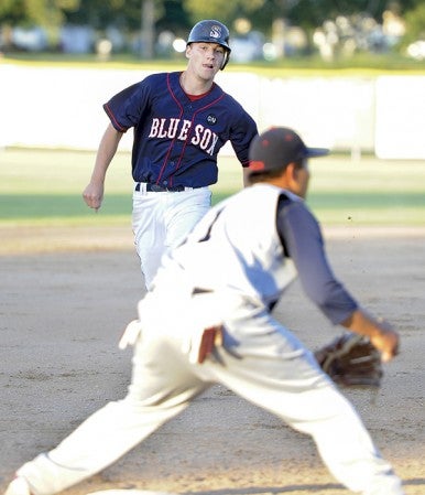 The Austin Blue Sox Lukas Anderson hones in on third base during the first inning against Burnsville Wednesday night at Marcusen Park. Eric Johnson/photodesk@austindailyherald.com