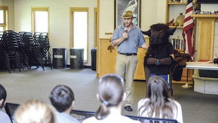 Alex Watson introduces Billy the Bison during his family program. 