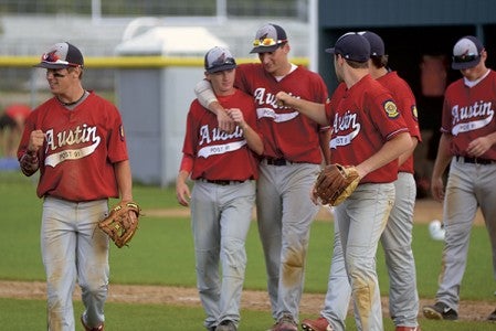 Daniel Bollingberg, left, and the Austin Post 91 Legion baseball team react after earning their first state berth in 25 years at Rochester Mayo Sunday night. Rocky Hulne/sports@austindailyherald.com