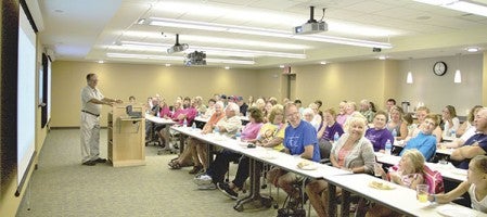 Jerry Anfinson, treasurer of The Hormel Foundation, speaks Sunday to a packed room of volunteers from the Lyle Area Cancer organization to thank them for their major fundraising efforts and explain how the Foundation significantly supports The Hormel Institute. Photos provided 