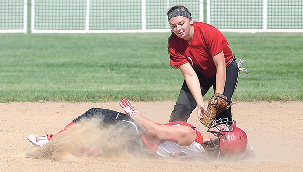 Austin U18’s McKayla Swenson receives a hard tag from the Worthington Storm’s Jenny Thorsen after stealing second during the U18 State Tournament Saturday morning at Todd Park.  Photos by Eric Johnson/photodesk@austindailyherald.com