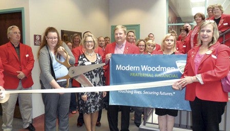 Crystal Knutson, pictured center left, has opened a Modern Woodmen agency in Austin. Modern Woodmen is a fraternal benefit society, offering life insurance and investments. Pictured alongside Crystal was Regional Manager Lana Karstens. The Austin Area Chamber of Commerce recently held a ribbon cutting to welcome the society as a new chamber member. 