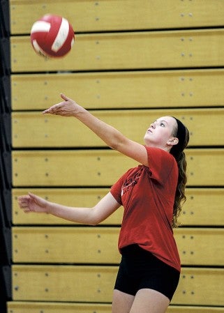 Abby Collins serves during practice. 